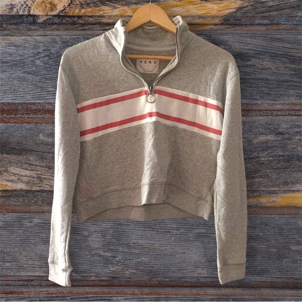 Quarter zip sweater with horizontal stripes across chest